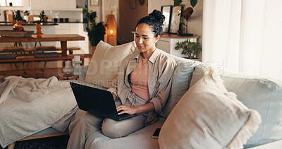 Buy stock photo Woman, typing and research on couch with laptop, remote work or website for digital marketing trend. Person, reading and browsing in home with computer, plan and freelance job for online advertising.