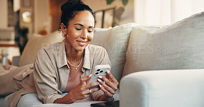Buy stock photo Woman, smile and browsing in home with phone, text message notification or website for digital news. Female person, typing and reading on sofa with tech, social media and mobile app for blog article.