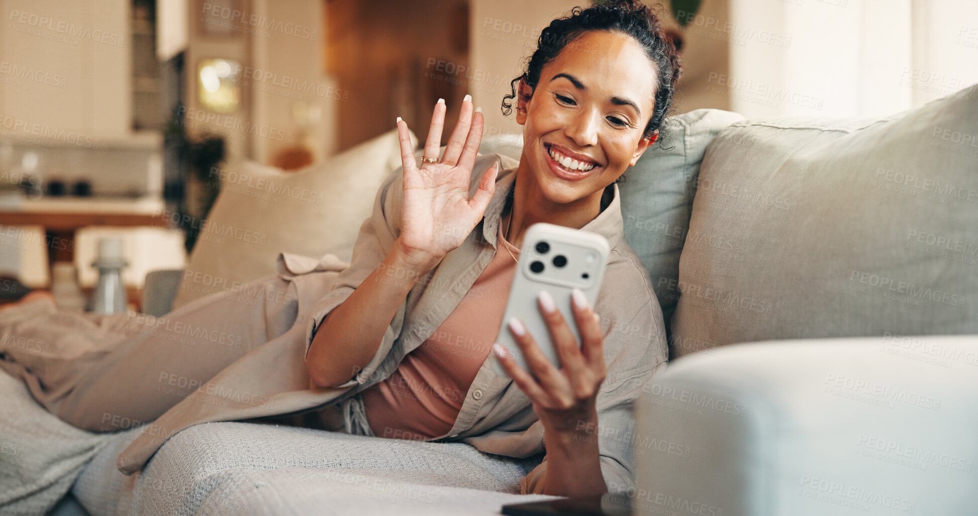 Buy stock photo Phone, video call and woman wave on sofa in home for greeting contact, online communication or relax. Living room, hello and person with mobile for virtual chat, smile and hand gesture in house