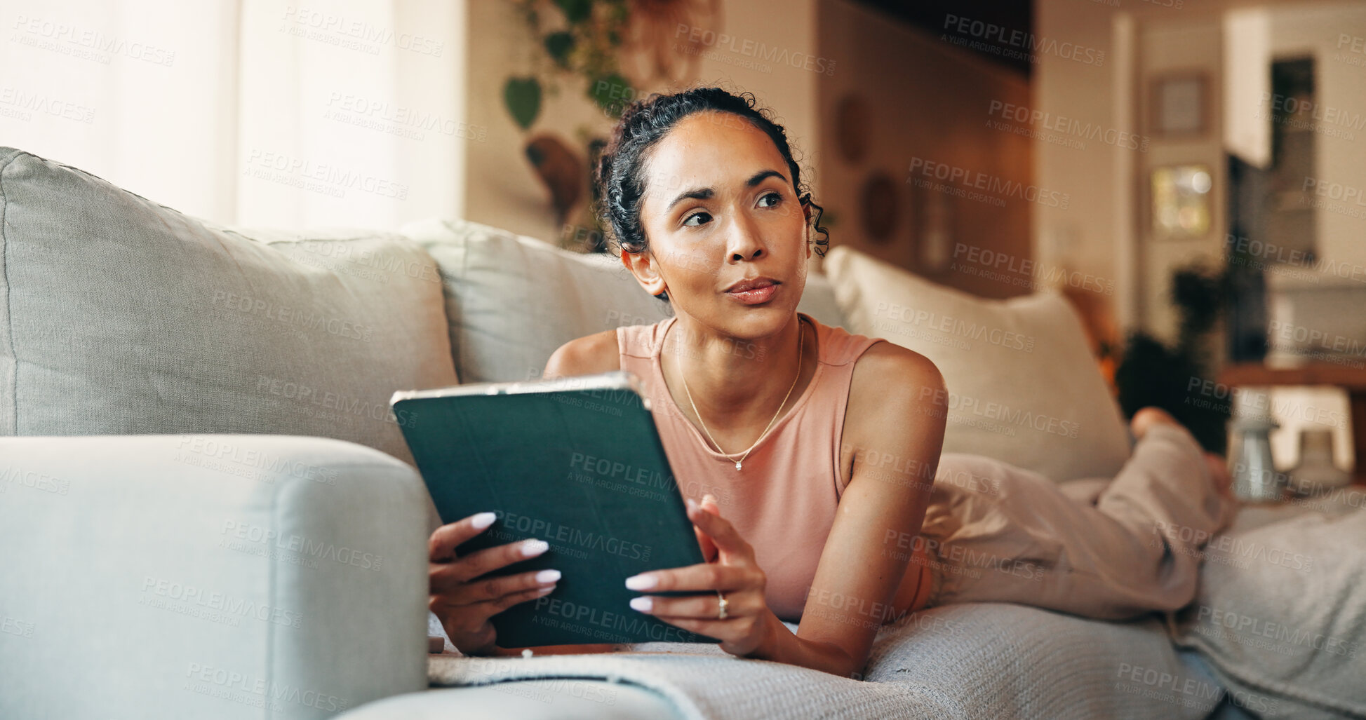 Buy stock photo Relax, tablet and thinking with woman on sofa in living room of home for social media browsing. App, scrolling and vision with thoughtful person in apartment for break, me time chilling or wellness