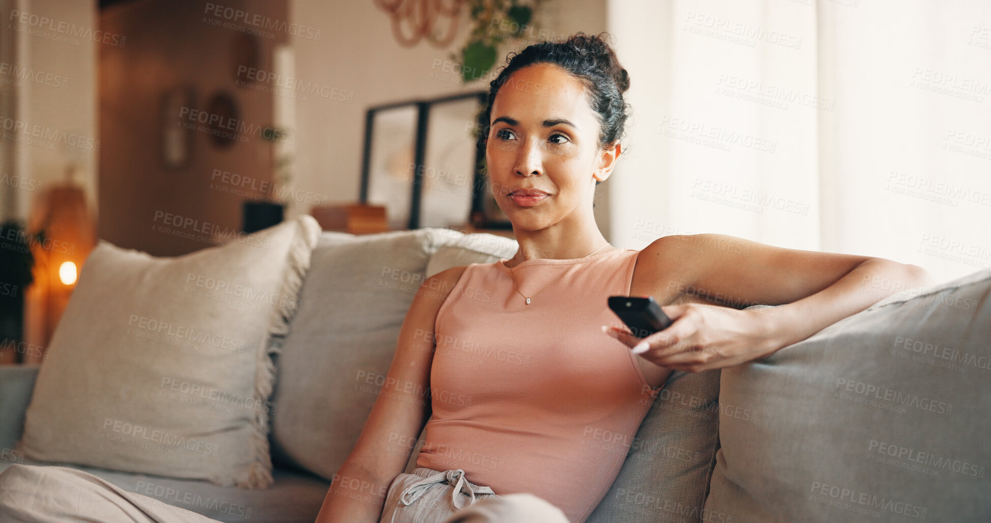 Buy stock photo Woman, relax or watching tv on couch with remote, streaming service or entertainment on weekend break. Female person, chill or change channel in home with tech, movie choice or subscription for film.