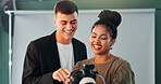 Discussion, photographer and model with camera in studio, review image and tips for expression check. Photography, tech or happy people with conversation for picture selection, pose idea and creative