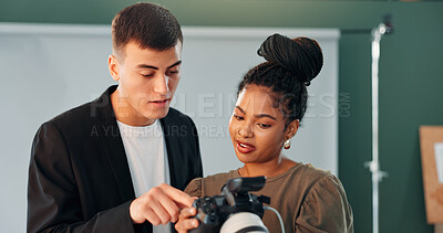 Buy stock photo Conversation, photographer and model with camera in studio, review image and tips for expression check. Photography, tech or people with discussion for picture selection, production idea or creative