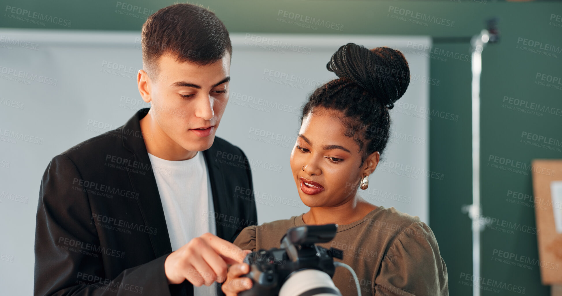 Buy stock photo Conversation, photographer and model with camera in studio, review image and tips for expression check. Photography, tech or people with discussion for picture selection, production idea or creative