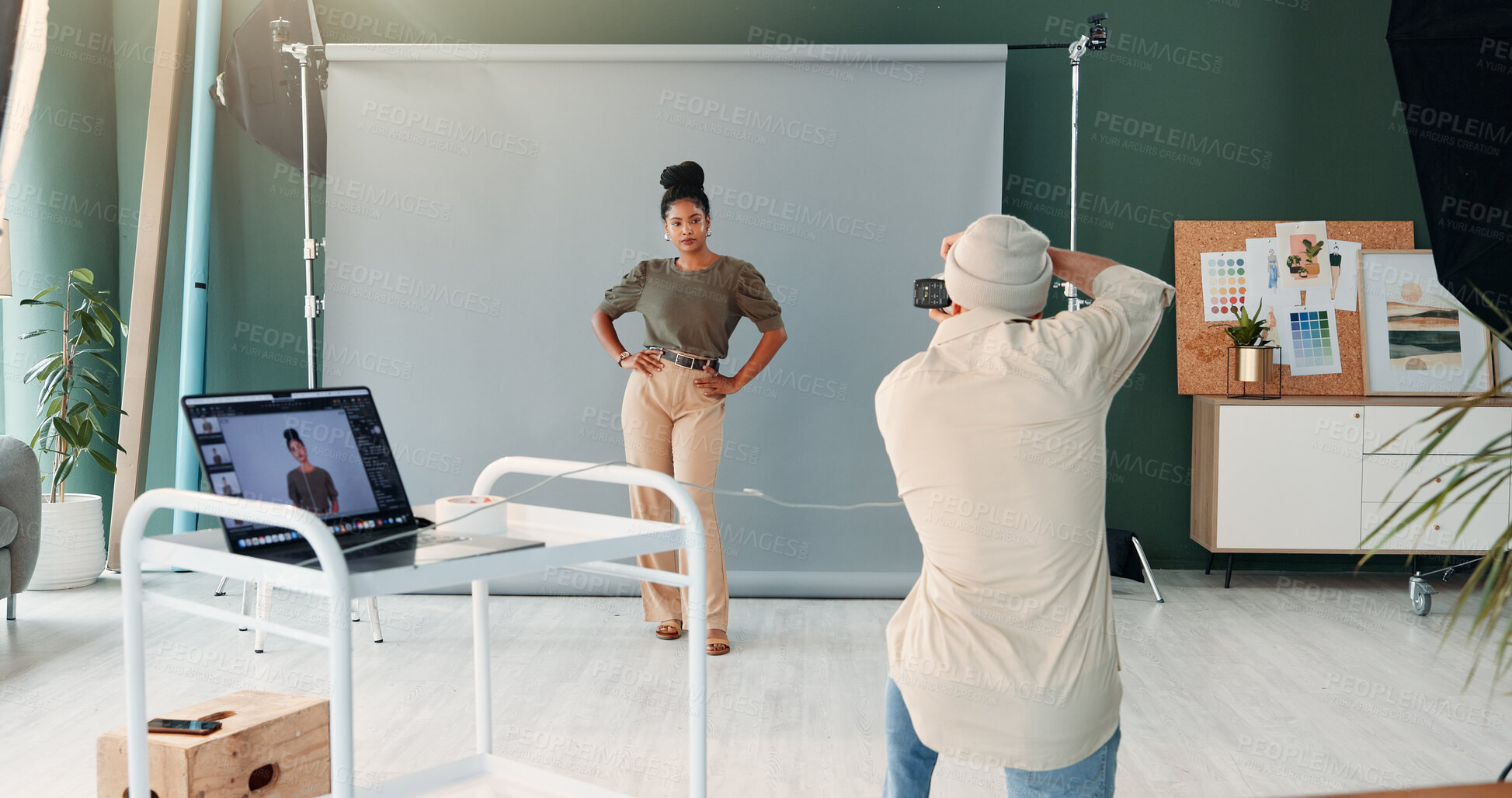 Buy stock photo BTS, media or production with model and photographer in studio for creative process or photoshoot. Camera, laptop screen or photography with man and woman behind the scenes for catalog campaign