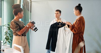 Buy stock photo Preparation, photoshoot and model in studio with stylist, getting ready and clothing option on set. Collaboration, people or film team with planning, fashion catalog and backstage in media production