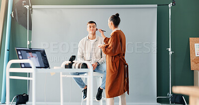 Buy stock photo Getting ready, makeup or photography with artist and model on set for film or media production. Cosmetics, preparation or process with man and woman in studio for behind the scenes photoshoot