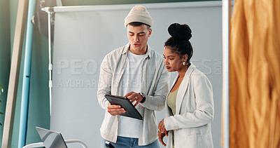 Buy stock photo Photography, tablet and teamwork with people in studio together for feedback or production planning. App, discussion or photoshoot with photographer man and woman on set for film idea or media review