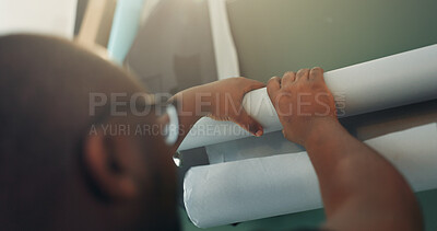 Buy stock photo Crew, hands and set up with man in film studio for creative coordination or photoshoot production. Backdrop, photography and rolling with employee behind the scenes to arrange, install or prepare