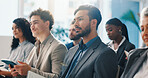 Audience, businessman and listening to seminar with notebook for finance expo, learning or speech. Convention, crowd and male person with attention, knowledge and notes for wealth management training