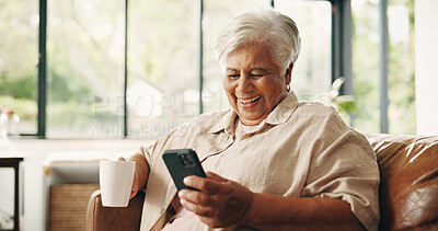 Buy stock photo Coffee, phone and laughing with old woman on sofa in home for retirement or social media. App, drinking and funny with happy senior person in living room of apartment for browsing or communication