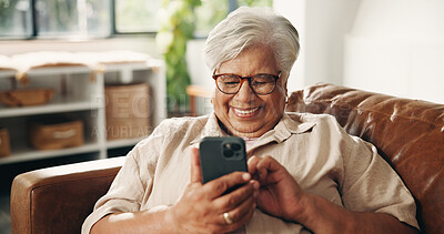 Buy stock photo Laughing, phone and relax with old woman on sofa in home for retirement or social media. App, funny and scrolling with happy senior person in living room of apartment for browsing or communication