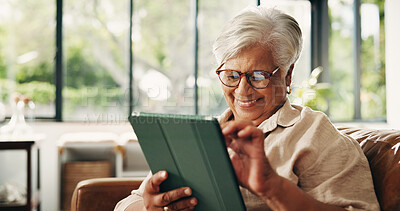 Buy stock photo Laughing, scrolling and tablet with old woman on sofa in home for retirement or social media. App, funny and reading with happy senior person in living room of apartment for browsing or connection