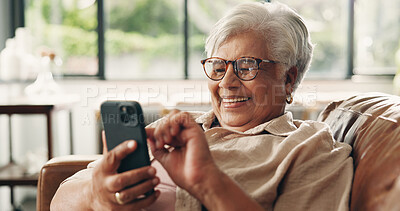 Buy stock photo Laughing, phone and relax with senior woman on sofa in home for retirement or social media. App, funny and scrolling with happy old person in living room of apartment for browsing or communication