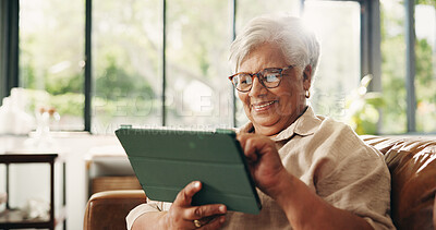 Buy stock photo Scrolling, smile and tablet with old woman on sofa in home for retirement or social media. App, glasses and search with happy senior person in living room of apartment for browsing or reading