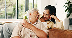 Senior, happy mom and daughter with laugh on sofa for funny joke, humor or comedy together in home. Elderly, mother and adult with smile, hug or comfort for bonding, love or family support in house