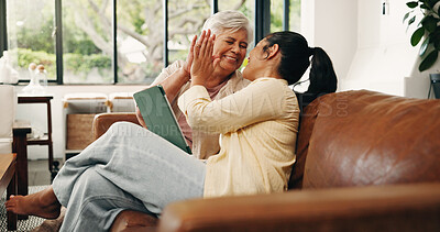 Buy stock photo High five, mother and tablet with adult daughter on sofa in home living room for online shopping. App, family and senior parent with woman in apartment together for ecommerce deal or success