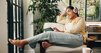 Buy stock photo Headphones, tablet and mature woman in home, streaming movie website and comfort series on weekend. Tech, relax and person with subscription service to watch film, podcast video and audiobook on sofa