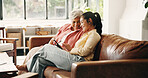 Smile, tablet or visit with old woman and daughter on sofa in home together for bonding or love. App, family or scrolling with adult child and senior parent in living room of apartment for retirement