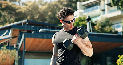 Buy stock photo Bodybuilder, man and outdoor with dumbbells for training, muscle development and health. Sunglasses, fitness and athlete person with weights for exercise by home for endurance, challenge and workout