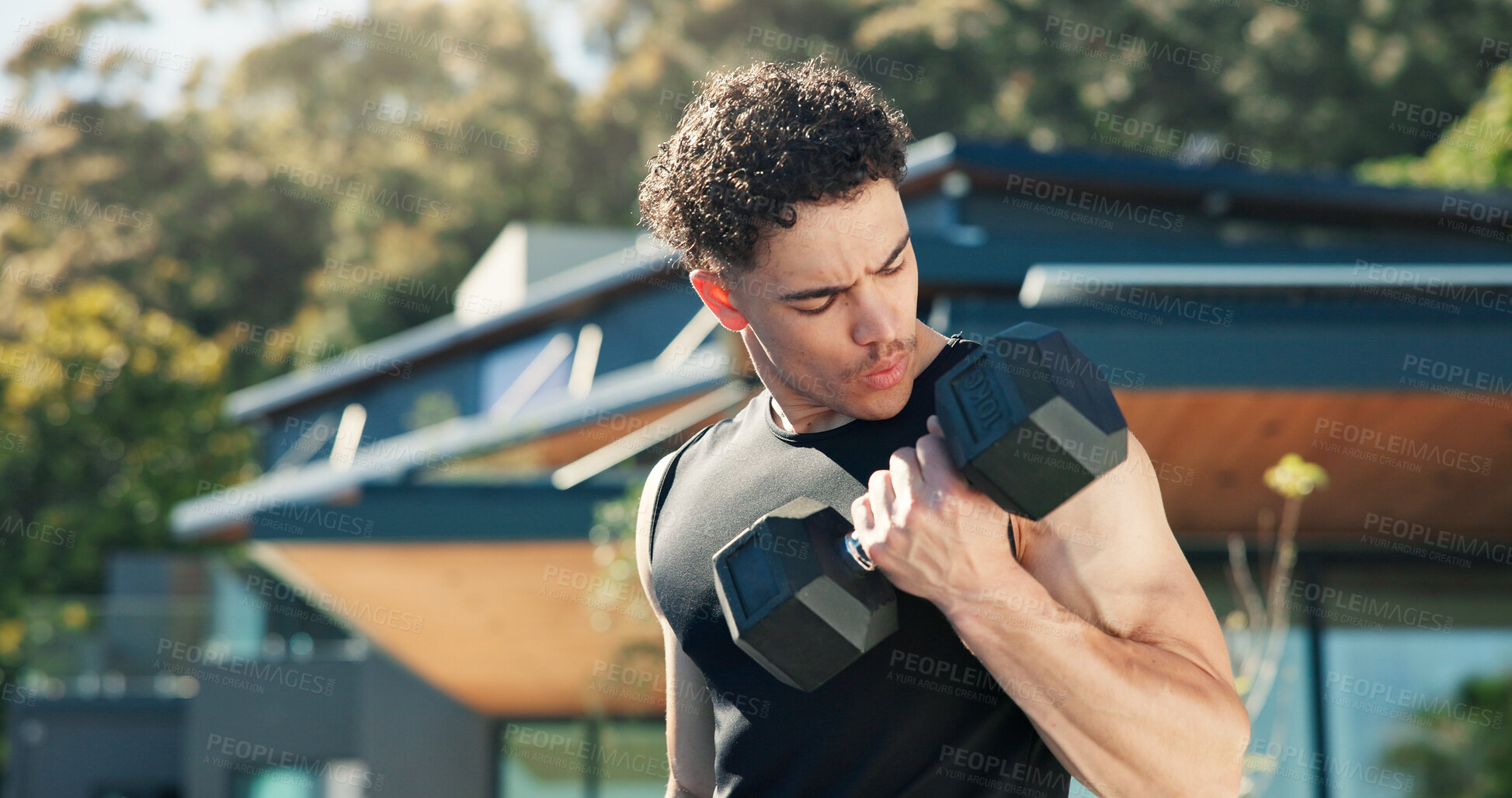 Buy stock photo Bodybuilder, man and outdoor with dumbbells for exercise, muscle development and health. Morning, training and athlete person with weights for fitness by home for endurance, challenge and workout