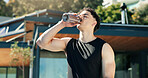 Drinking, water and man on break, fitness and body recovery after exercise routine, rest and outdoor. Workout, athlete and person with bottle for hydration, home and wellness with drink or liquid