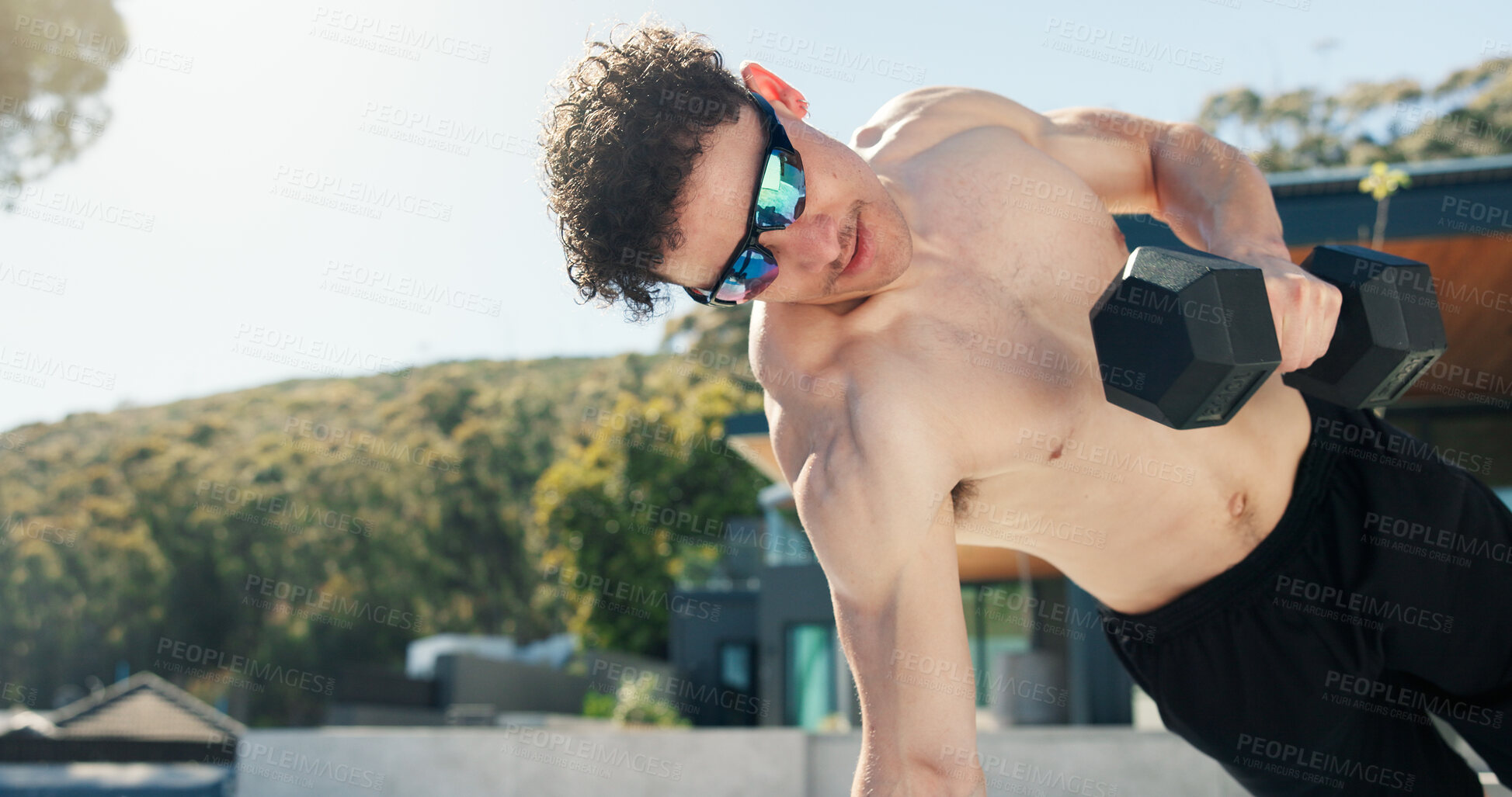 Buy stock photo Athlete, man and plank with dumbbell in backyard for fitness, bicep exercise and body balance. Male person, sunglasses and bodybuilder with gear, strength training and power workout at house outdoor