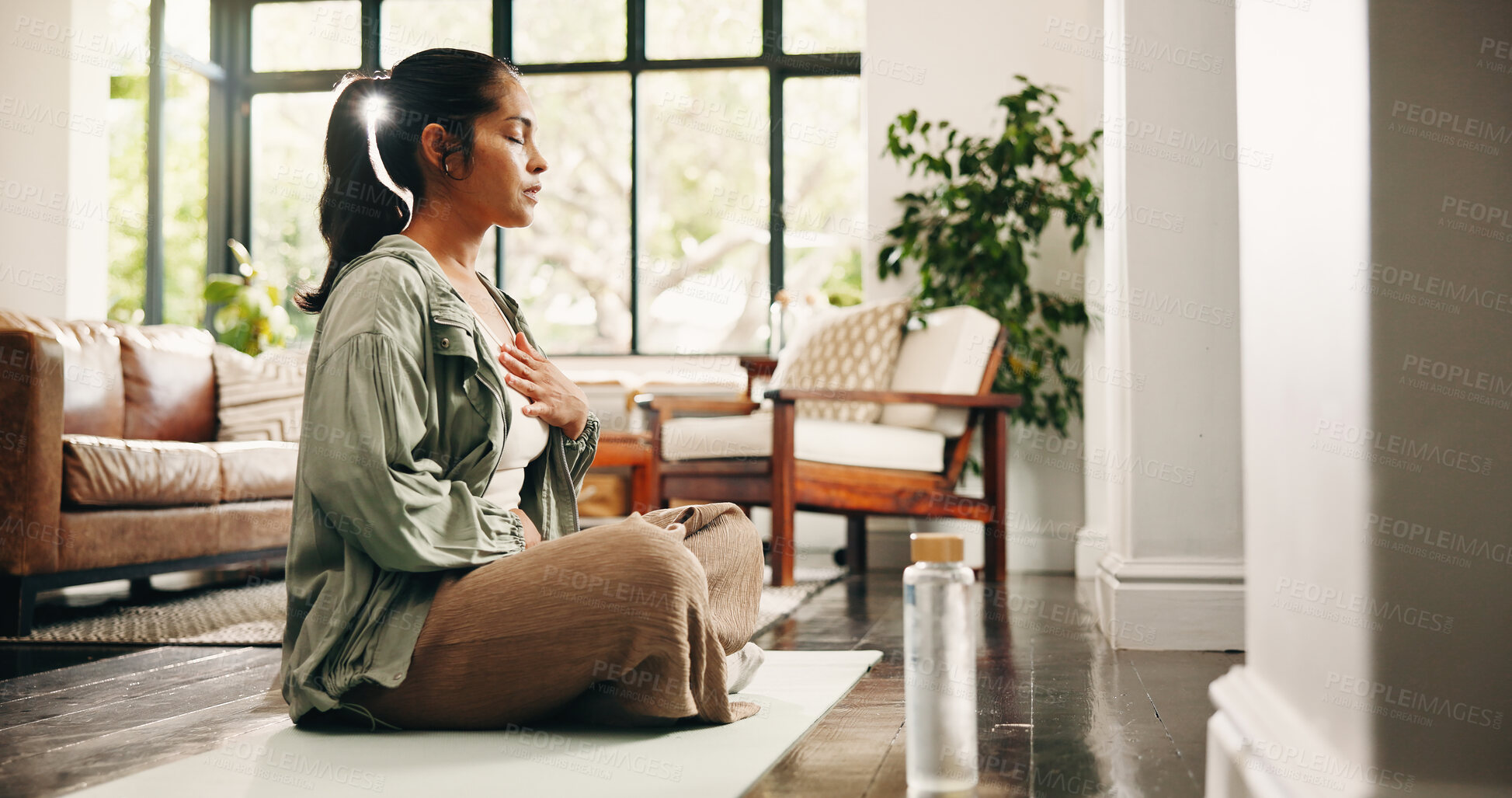 Buy stock photo Woman, meditation and breathing in home with yoga mat, chakra healing and spirituality for wellness. Flare, mature person and mindfulness in lounge with breathwork exercise, peace or holistic health.