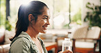 Smile, morning or woman in home with water bottle, hydration or digestion support in daily routine. Refresh, flare or female person in lounge with cold beverage, mineral liquid or h2o detox in thirst