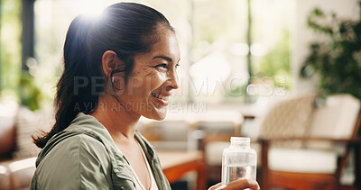 Buy stock photo Smile, morning or woman in home with water bottle, hydration or digestion support in daily routine. Refresh, flare or female person in lounge with cold beverage, mineral liquid or h2o detox in thirst