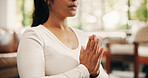Yoga, namasta or hands in living room with meditation, calm practice or mindfulness in wellness activity. Inner peace, bokeh or woman in home with lotus, zen or mindset improvement in holistic health
