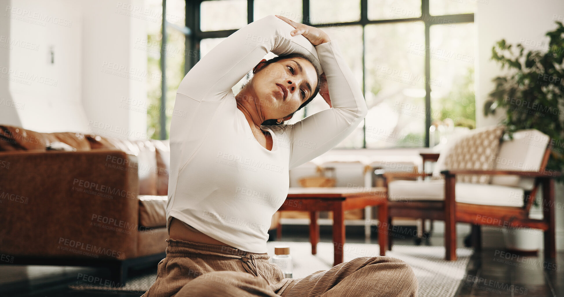 Buy stock photo Fitness, stretching and woman with yoga in home, morning practice or warm up exercise for wellness. Holistic routine, active or mature person with mobility activity in lounge, getting ready or health