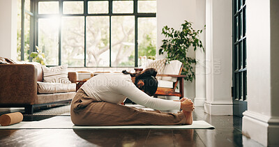 Buy stock photo Yoga, stretching or woman with mat in house, morning practice or flexibility routine for body awareness. Holistic exercise, pilates or person with forward bend in lounge, posture or wellness activity