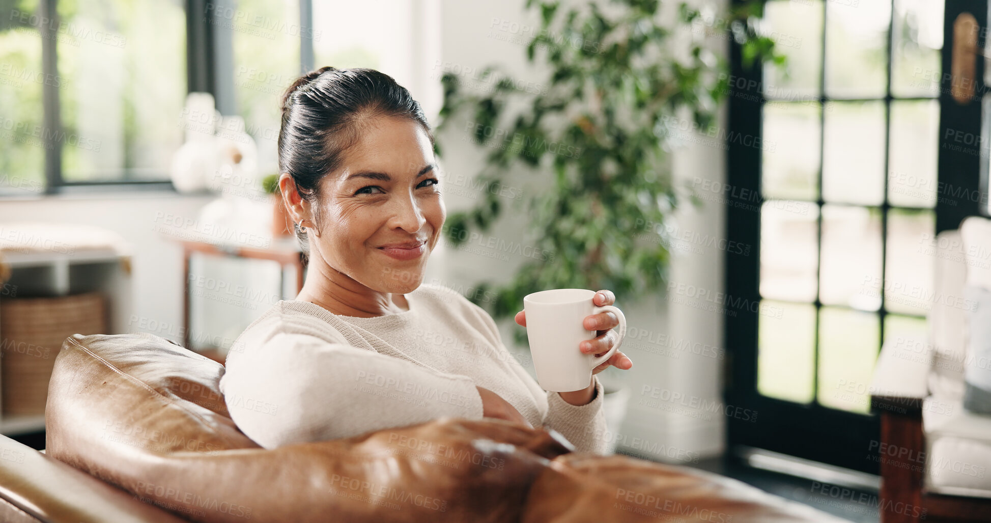 Buy stock photo Coffee, morning and portrait of woman on sofa with drink for wellness, calm and relax in living room. Happy, house and person smile with beverage on couch for peaceful, me time and break on weekend