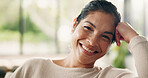 Portrait, relax or woman on sofa with smile in living room in home, house or apartment. Face, comfortable lady or happy female person on couch with peace or confidence resting on break for wellness