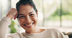 Portrait, relax or woman on couch with smile in living room in home, house or apartment. Face, comfortable lady or happy female person on sofa with peace or confidence resting on break for wellness