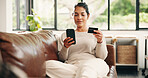 Happy woman, phone or relax with credit card on sofa for online shopping, banking or payment in home. Female person, shopper or user with debit or mobile smartphone for ecommerce, order or purchase