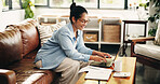 Budget, laptop and woman in home with paperwork for finance review, online banking and payment. Writing, computer and person with documents for planning expenses, income and financial report on sofa