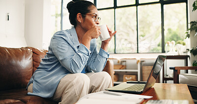 Buy stock photo Thinking, coffee and laptop with woman on sofa in home for research, startup planning and account vision. Entrepreneur budget, problem solving and drink with person in living room for remote work