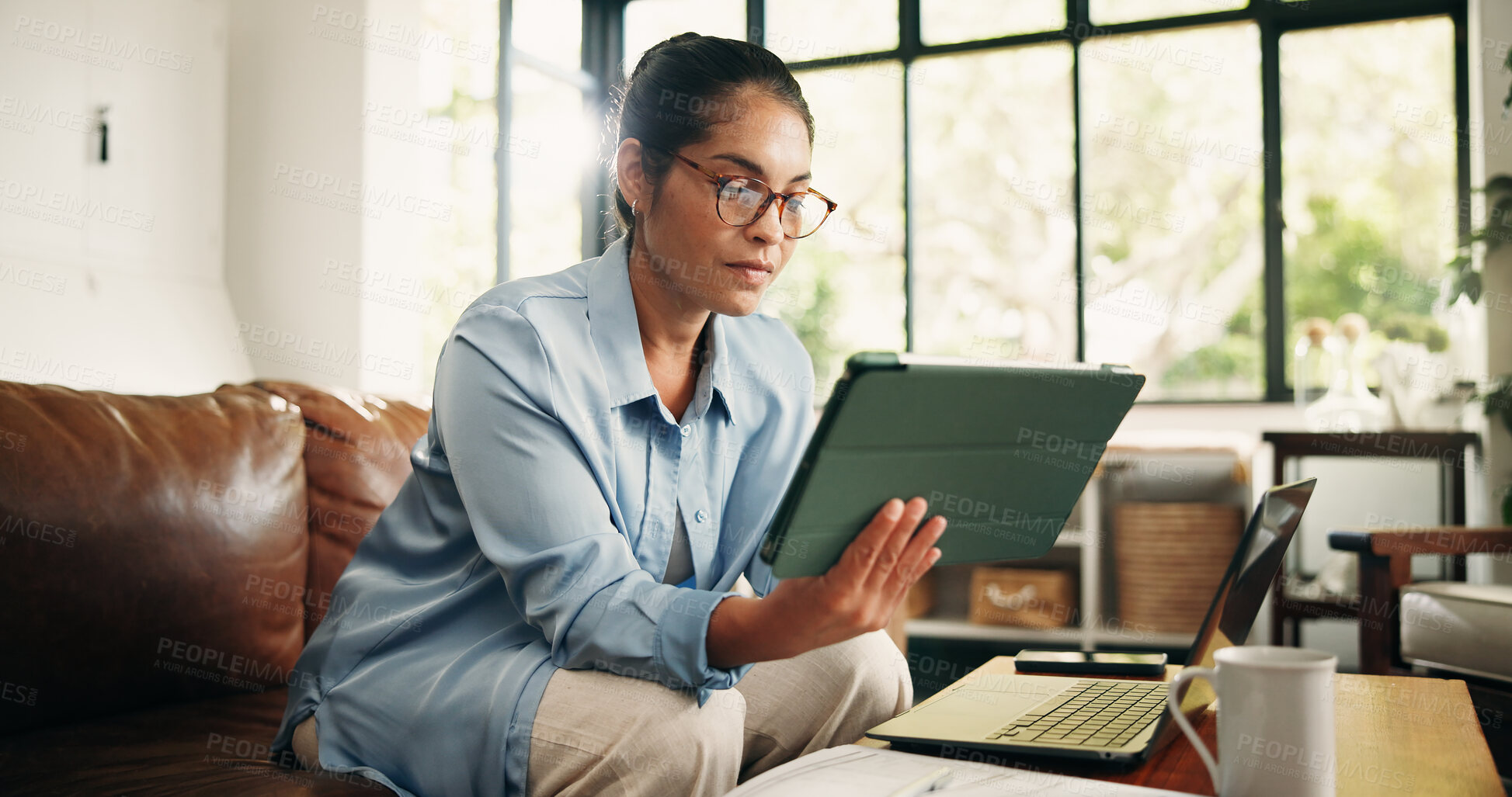 Buy stock photo Remote work, tablet and woman in home for editing report, article review or online submission. Freelancer, sofa and person on digital tech for story research, proofreading or planning for copywriting