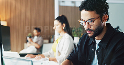 Buy stock photo Creative, typing and man with laptop, office or planning for article publication, serious and online. Media, reporter and person with tech for story, coworking and blog post on website in newsroom