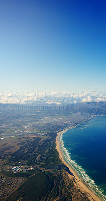 Buy stock photo Aerial view, ocean and coast with blue sky, mountains and cliff with space, outdoor and nature in summer. Sea, shoreline and water with landscape, beach and above for hills with clouds on horizon