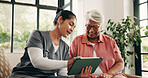 Healthcare, tablet or talking with nurse and old woman in home living room for feedback or review. App, conversation or medical checkup with caregiver and senior patient in apartment for diagnosis
