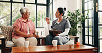 Old woman, nurse and discussion on sofa with clipboard, medical advice or explain prescription pills. Senior person, caregiver and talk in retirement center with checklist, medicine update or review.