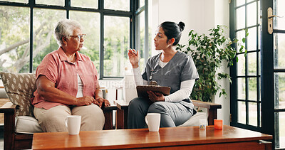 Buy stock photo Old woman, nurse and discussion on sofa with clipboard, medical advice or explain prescription pills. Senior person, caregiver and talk in retirement center with checklist, medicine update or review.