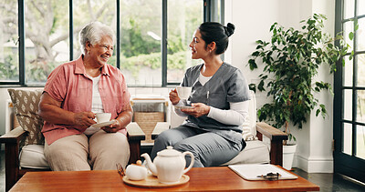 Buy stock photo Caregiver, discussion and drinking tea in nursing home with old woman, visit and bonding together. Happy, senior person and nurse in retirement center with warm beverage, kindness and conversation.