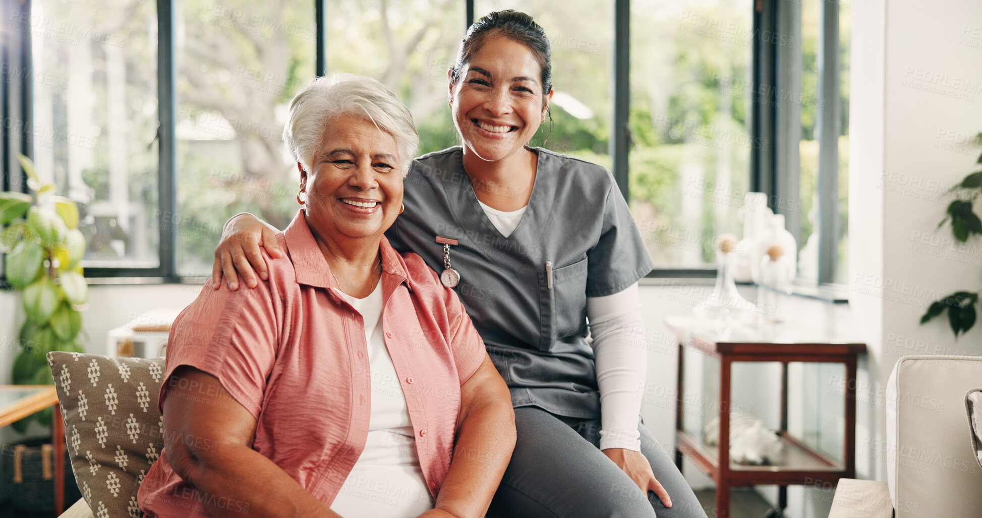 Buy stock photo Caregiver, portrait and old woman in lounge with hug, trust or bonding together in assisted living. Happy, elderly patient or nurse in house with embrace, connection and support in retirement care.