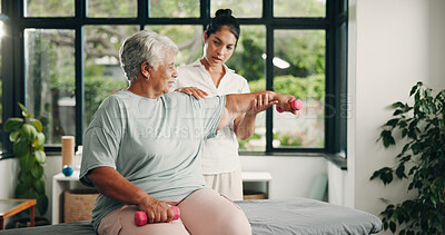Buy stock photo Physiotherapist, dumbbells or senior woman in clinic, medical recovery evaluation or arm exercise. Help, specialist or old person with injury assessment for healing progress, weights or strength test