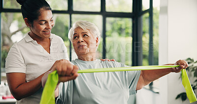 Buy stock photo Woman, physiotherapy or elderly with resistance band for arm exercise or muscle recovery in clinic. Female person, physio or helping senior patient with physiotherapist for support in health center 