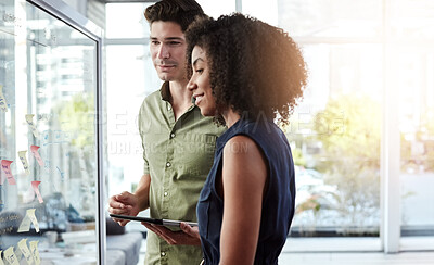 Buy stock photo Tablet, brainstorming and people in office with glass wall, creative idea or discussion for marketing. Team, planning and strategy in workplace with digital tech, sticky note and advertising project.